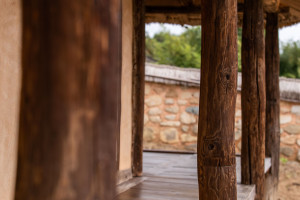 The veranda floor of the guesthouse and stone walls