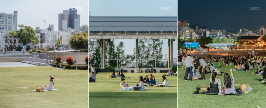 Visitors enjoy the early summer day on the grass lawn of the Hanul Madang